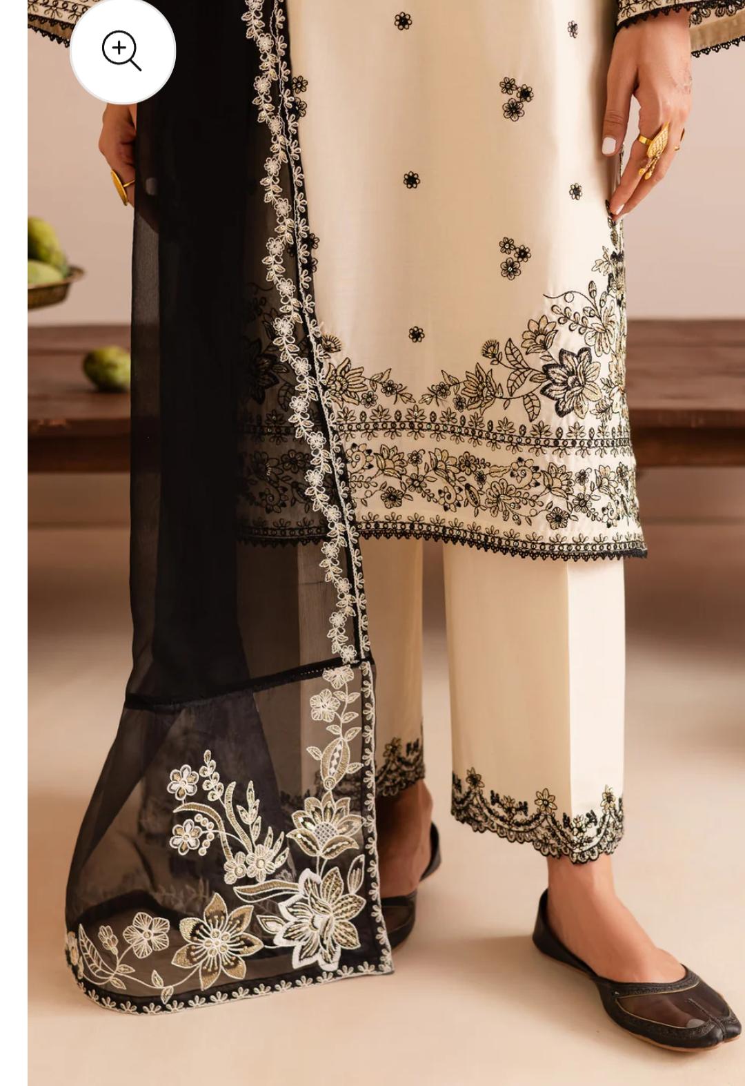 Black and white embroidered traditional outfit with sheer overlay