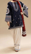 Traditional outfit with navy blue embroidered top and white pants on a beige background