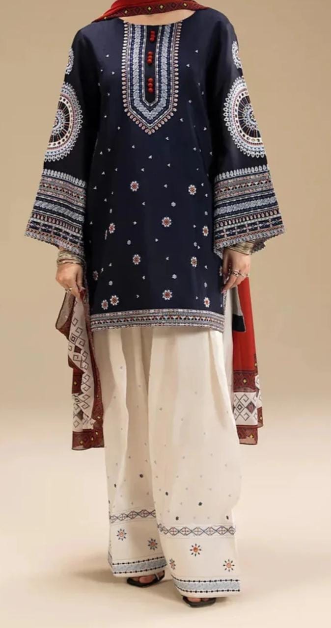 Traditional outfit with navy blue top and white pants on a beige background