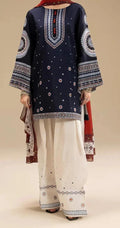 Traditional outfit with navy blue top and white pants on a beige background
