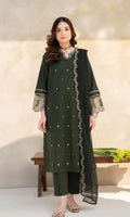 Woman wearing a green embroidered outfit with a neutral background