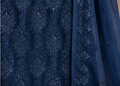 Navy blue fabric with intricate pattern and sequin embellishments