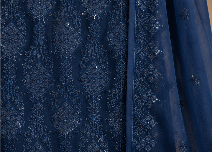 Navy blue fabric with intricate pattern and sequin embellishments