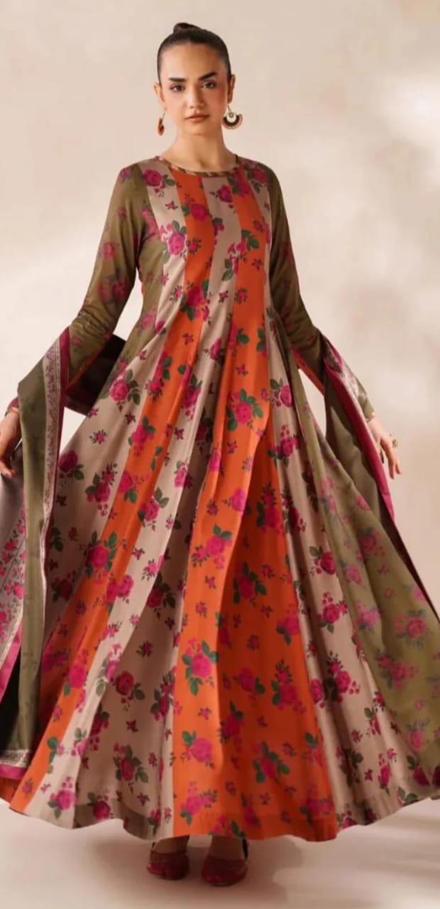 Woman wearing a floral dress with a gradient of colors against a neutral background